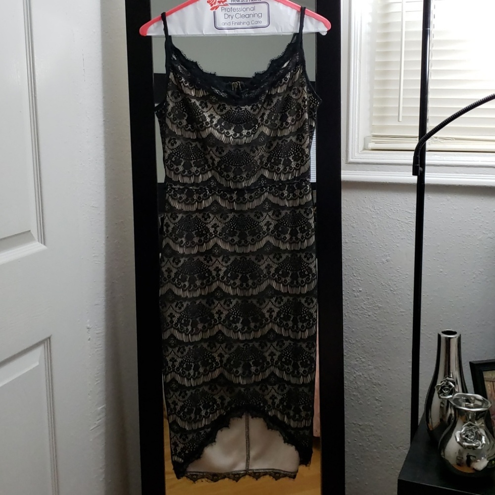 Black lace dress with beige slip